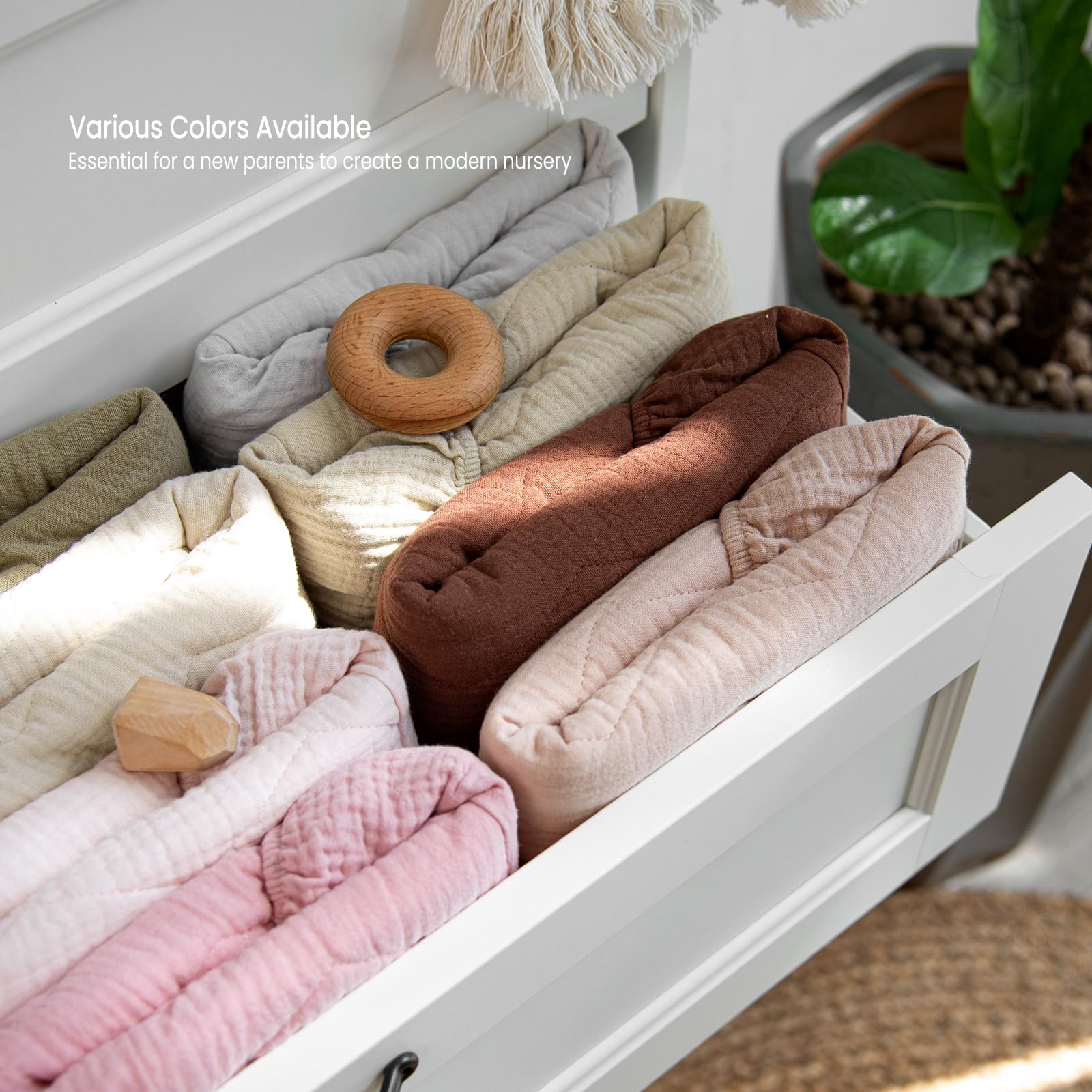 Lulumoon muslin changing pad cover machine-washable for easy care.