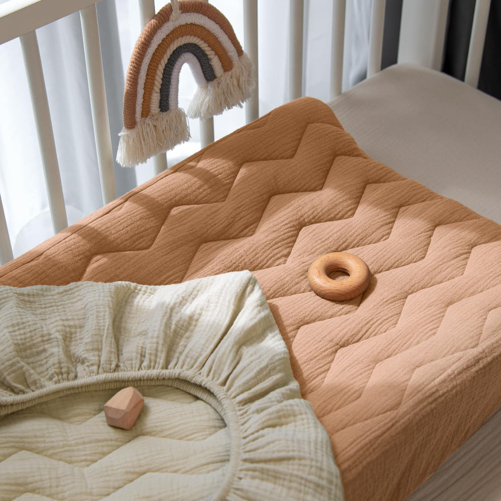 Lulumoon cover coordinates with nursery decor and daily diaper changes.