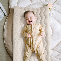 Close-up of quilted cotton filling on Lulumoon changing pad cover