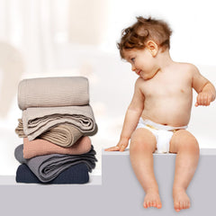 Lulumoon swaddle-ready ivory blanket measures 47x47 inches for cozy coverage