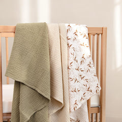 lulumoon muslin swaddle olive branches folded for easy hospital swaddling and secure snug wrap.