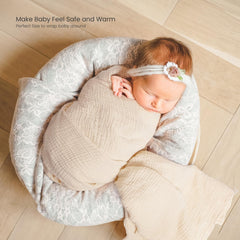 lulumoon muslin swaddle olive branches displayed on a stroller for sun shade and light coverage.