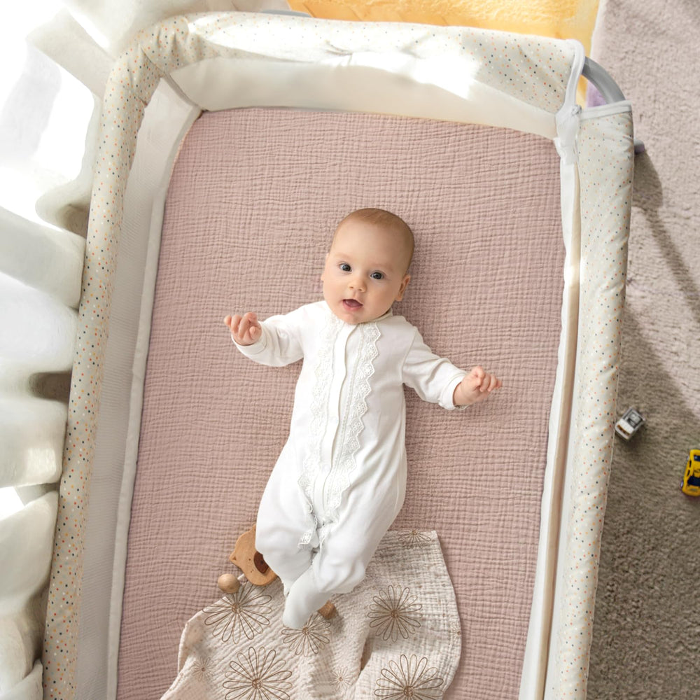 lulumoon Pack N Play Sheets muslin folded to illustrate compact storage and reuse.