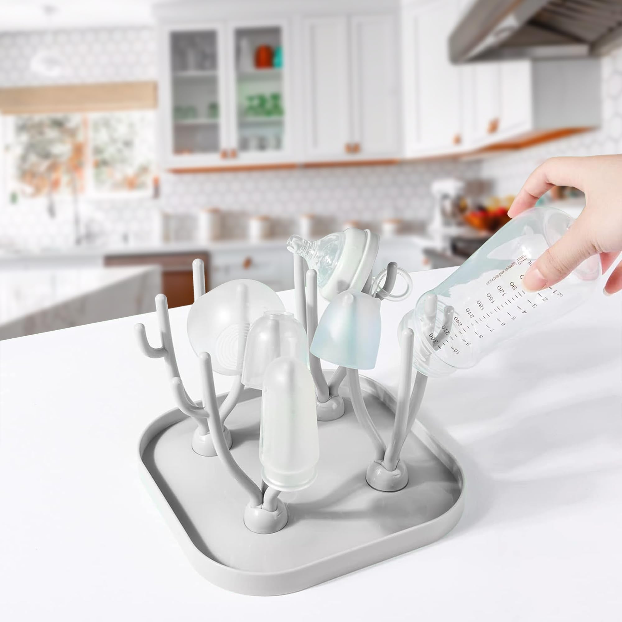 Lulyboo 16-bottle capacity rack dries bottles and accessories efficiently.