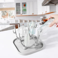 Lulyboo 16-bottle capacity rack dries bottles and accessories efficiently.