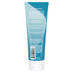 Pouring Lume Acidified Body Wash to cleanse odor-prone skin.