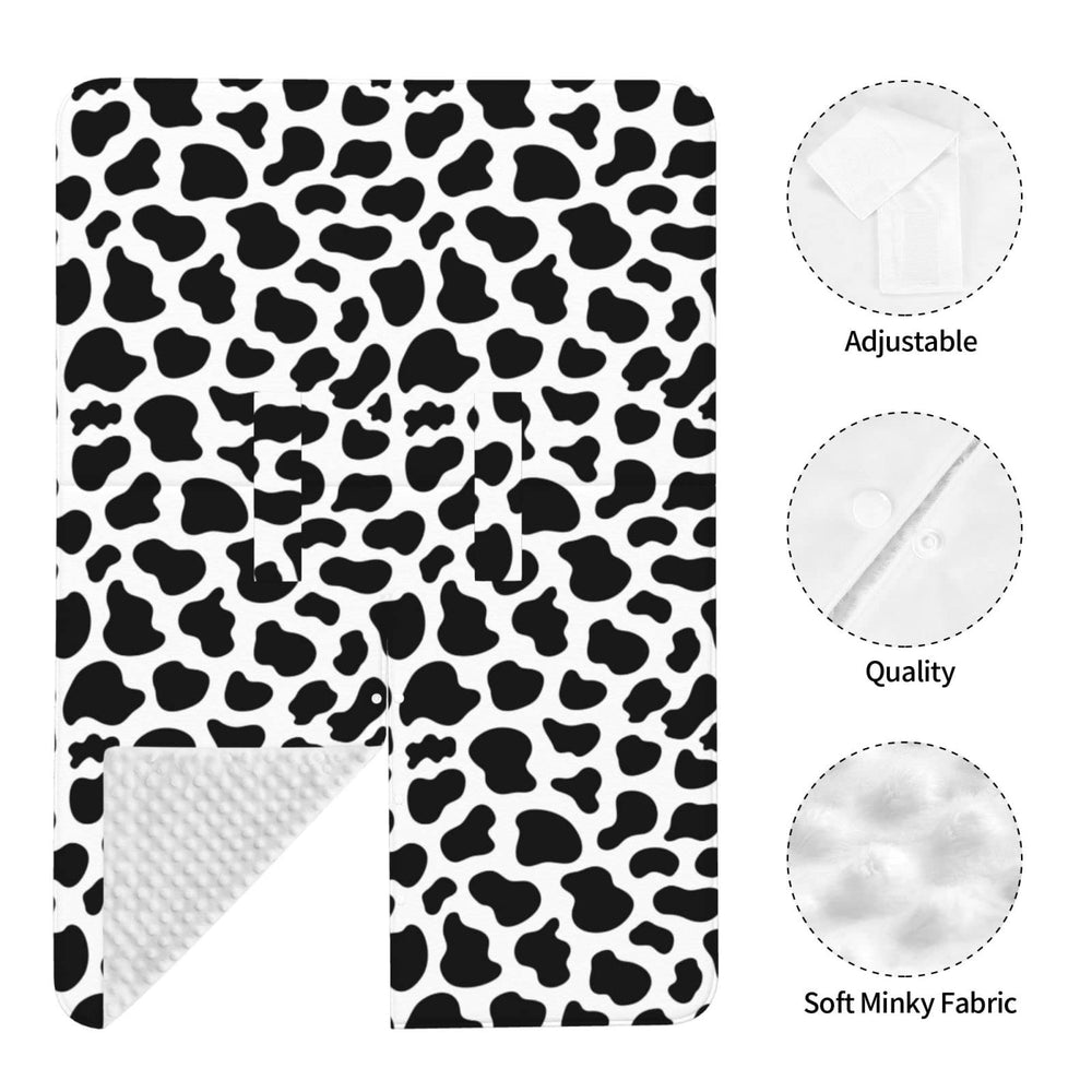 Lunepon cow-print changing pad protects surfaces during diaper changes.