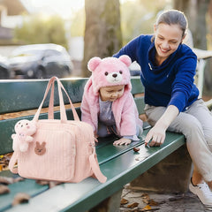 Lushandy mommy bag with adjustable strap for hands-free carrying.