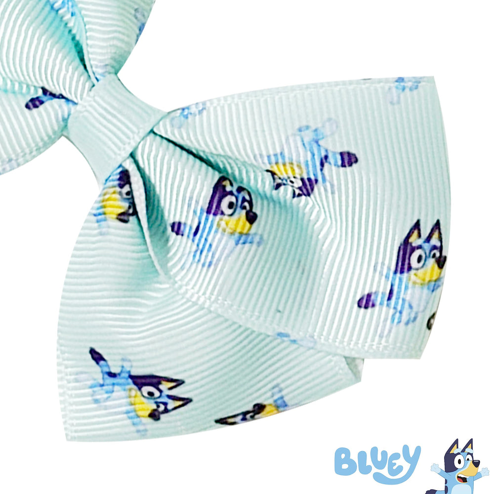 LUV HER Bluey bows arrive on a gift-ready card presentation.