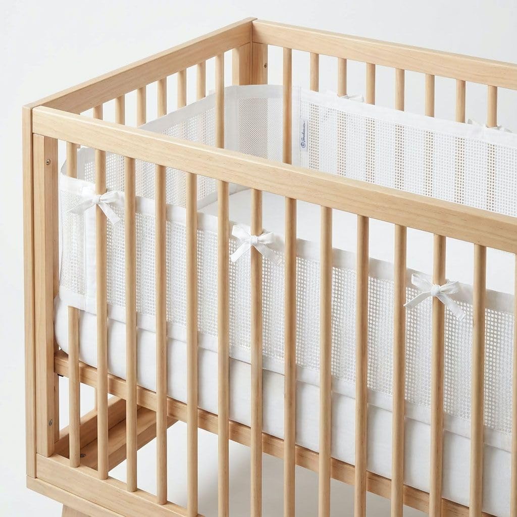 Luvberries breathable mesh crib liner for airflow and arm protection in standard cribs.