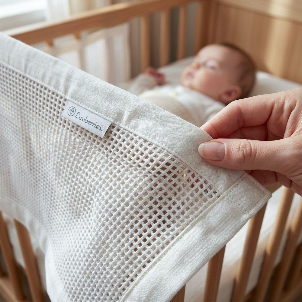 Luvberries three-layer mesh crib liner adds light cushioning while remaining breathable for baby.