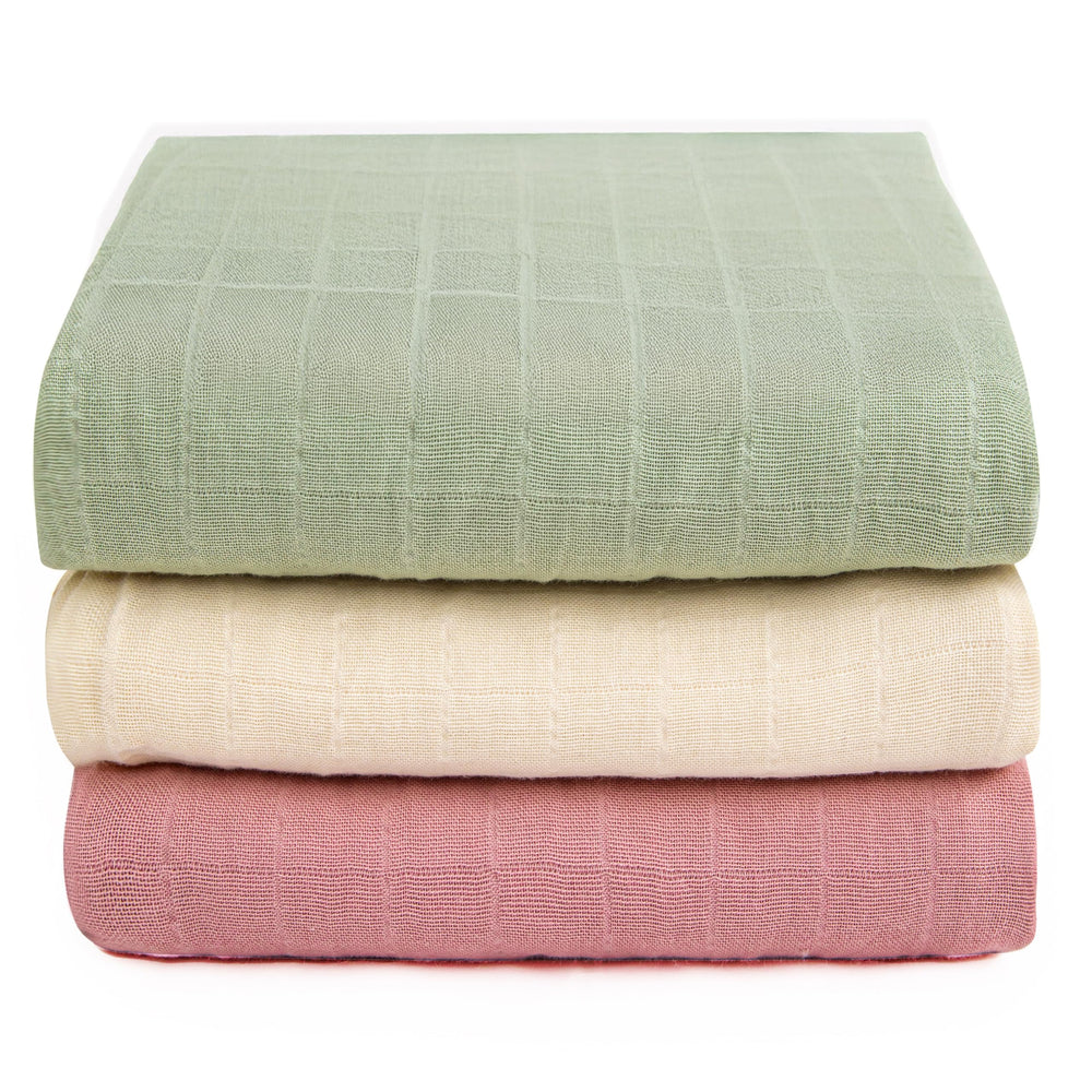 Luvvie organic muslin swaddle blanket with star pattern for gentle, breathable newborn comfort.