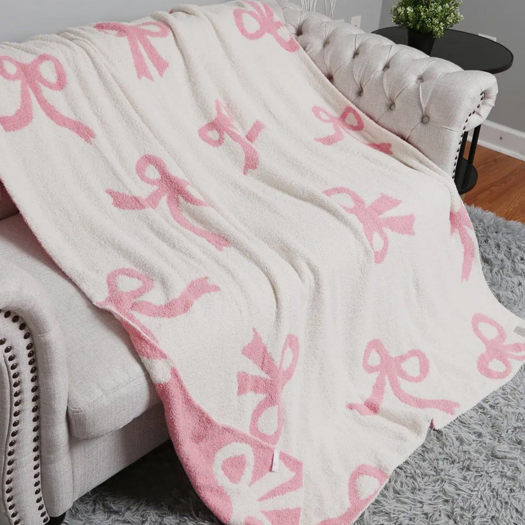 Luxape Bow Blanket nursery decor adds charm and warmth.