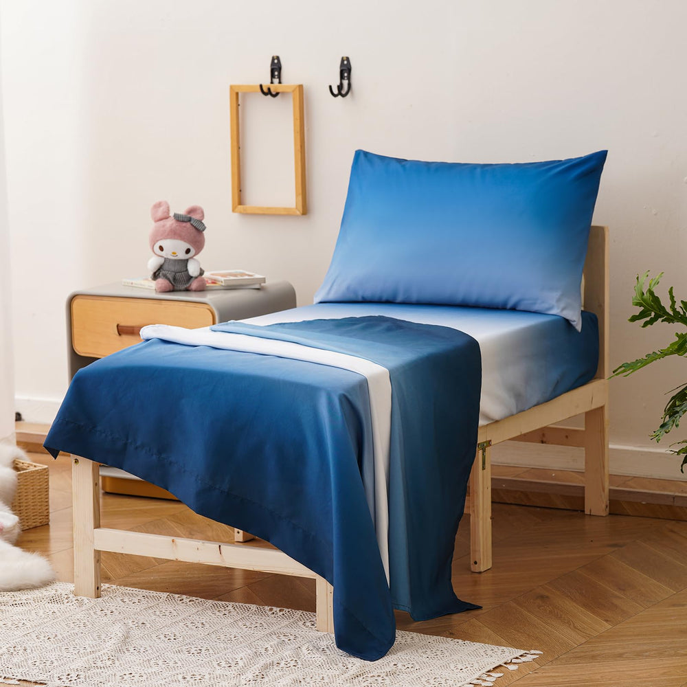 Luxlovery toddler comforter set laid out in 4-piece arrangement for kids.