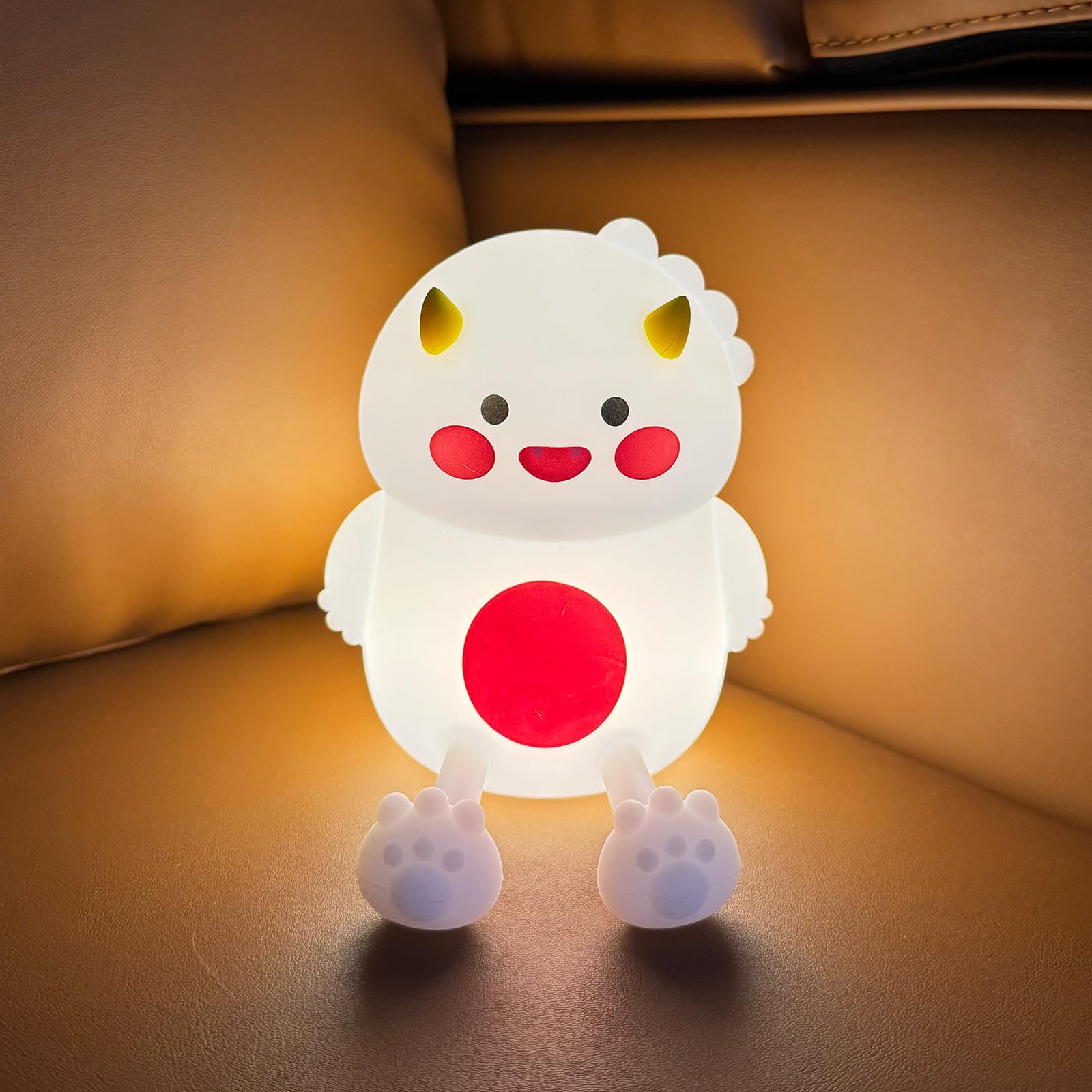 Lwalaneng dinosaur night light in breastfeeding setup for hands-free visibility