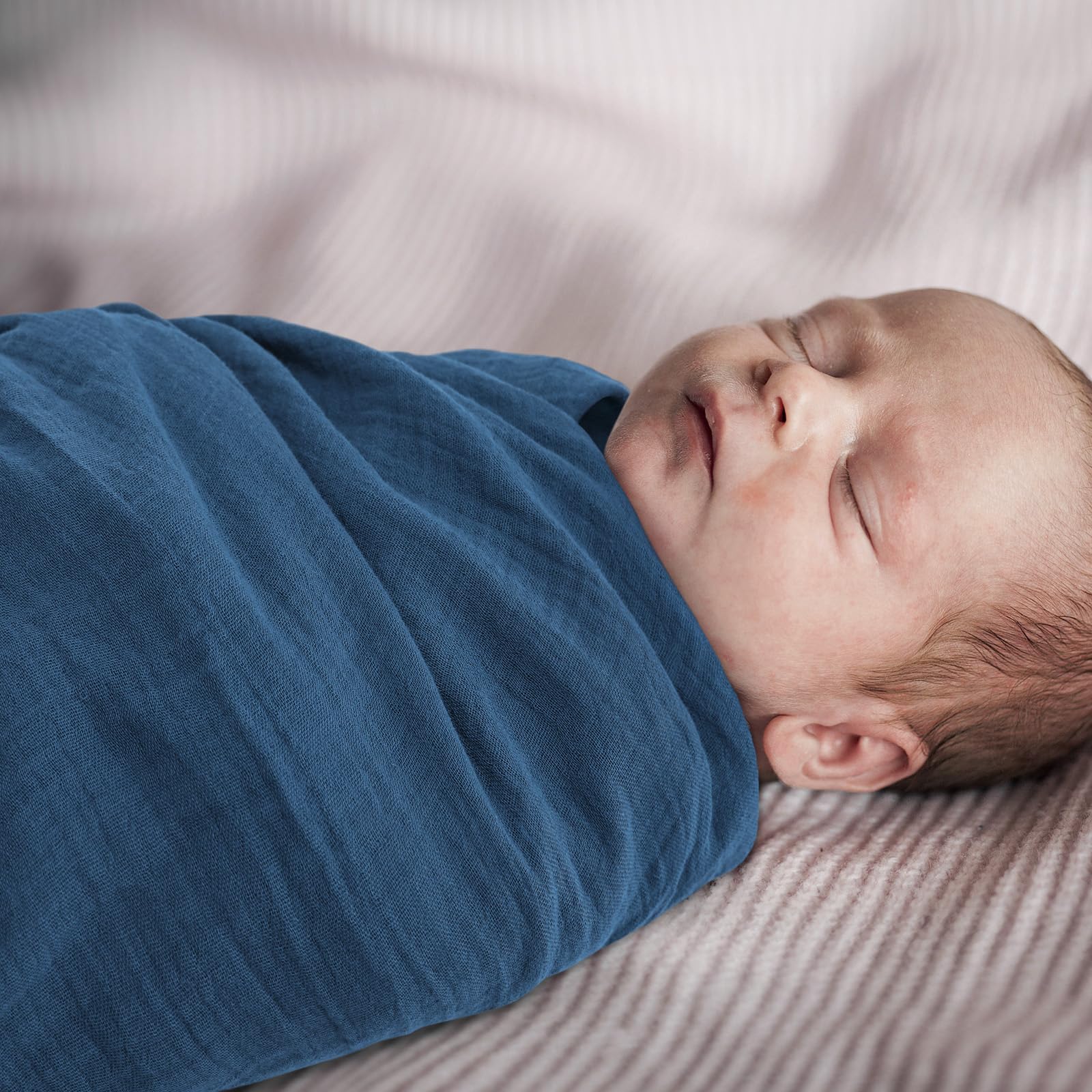 Soft, breathable blanket convenient for bath time, feeding, or burping.