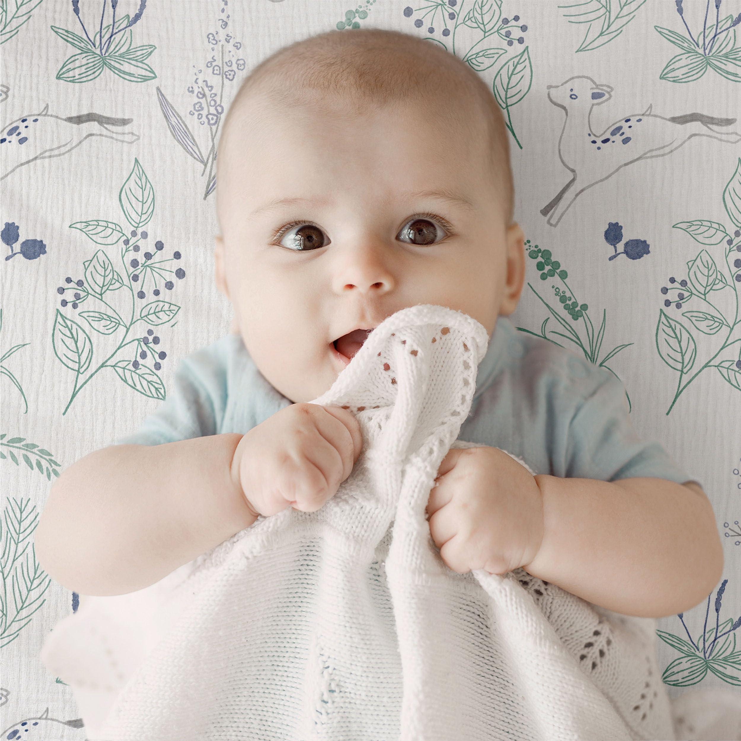 LYRICHOM BABY muslin sheets on oval bassinet mattress showing snug elastic fit