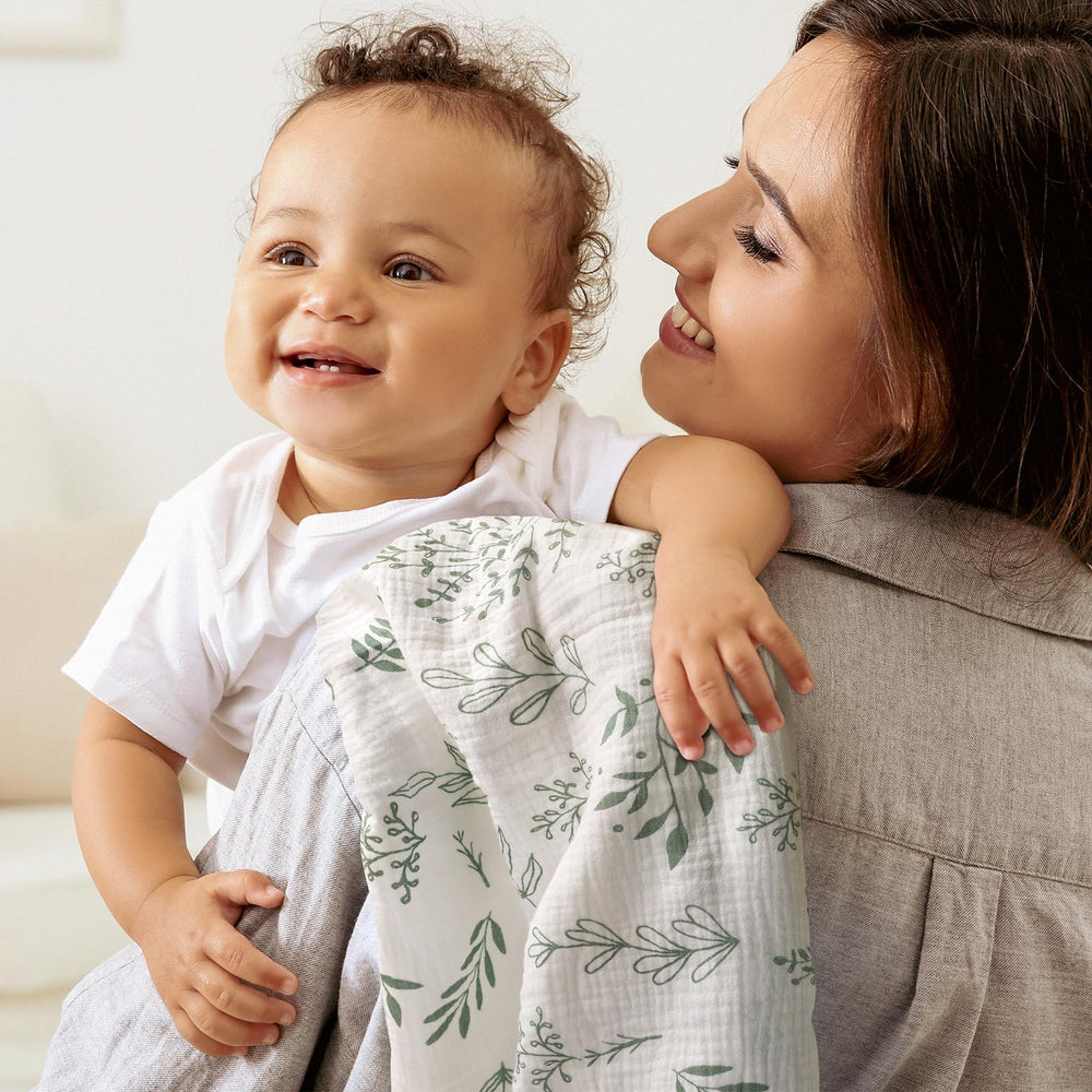 LYRICHOM BABY muslin swaddle closeup reveals soft fabric texture and neat stitching.