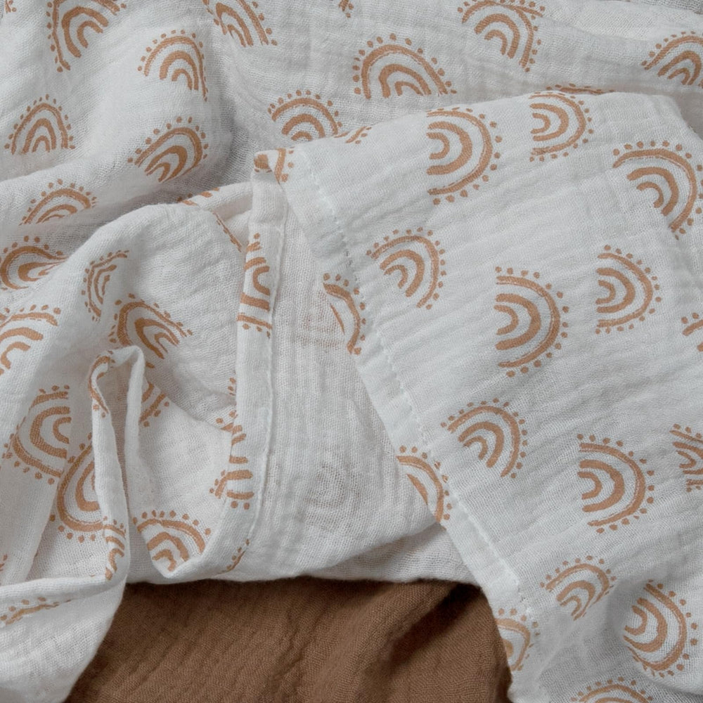 LYRICHOM BABY muslin swaddle blanket being machine washed for easy care