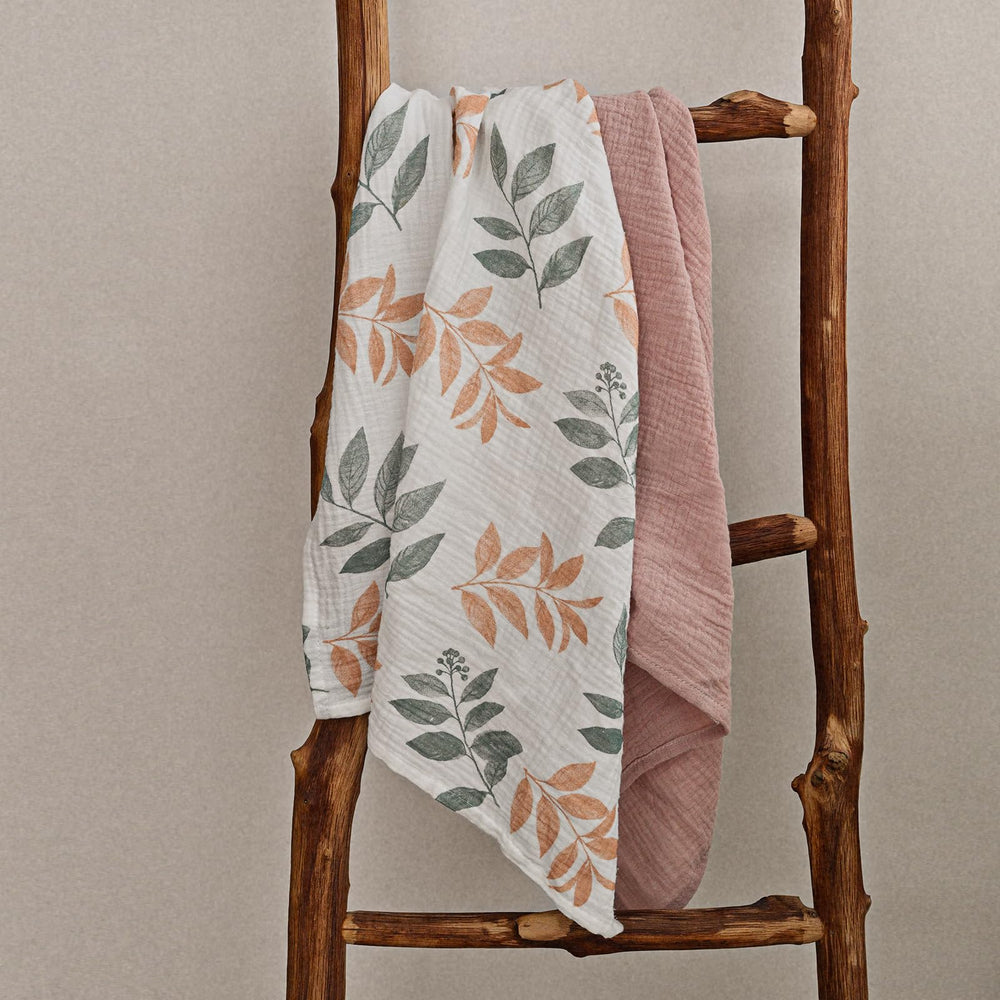 LYRICHOM Baby muslin swaddle blanket demonstrates versatility for burping or wipes
