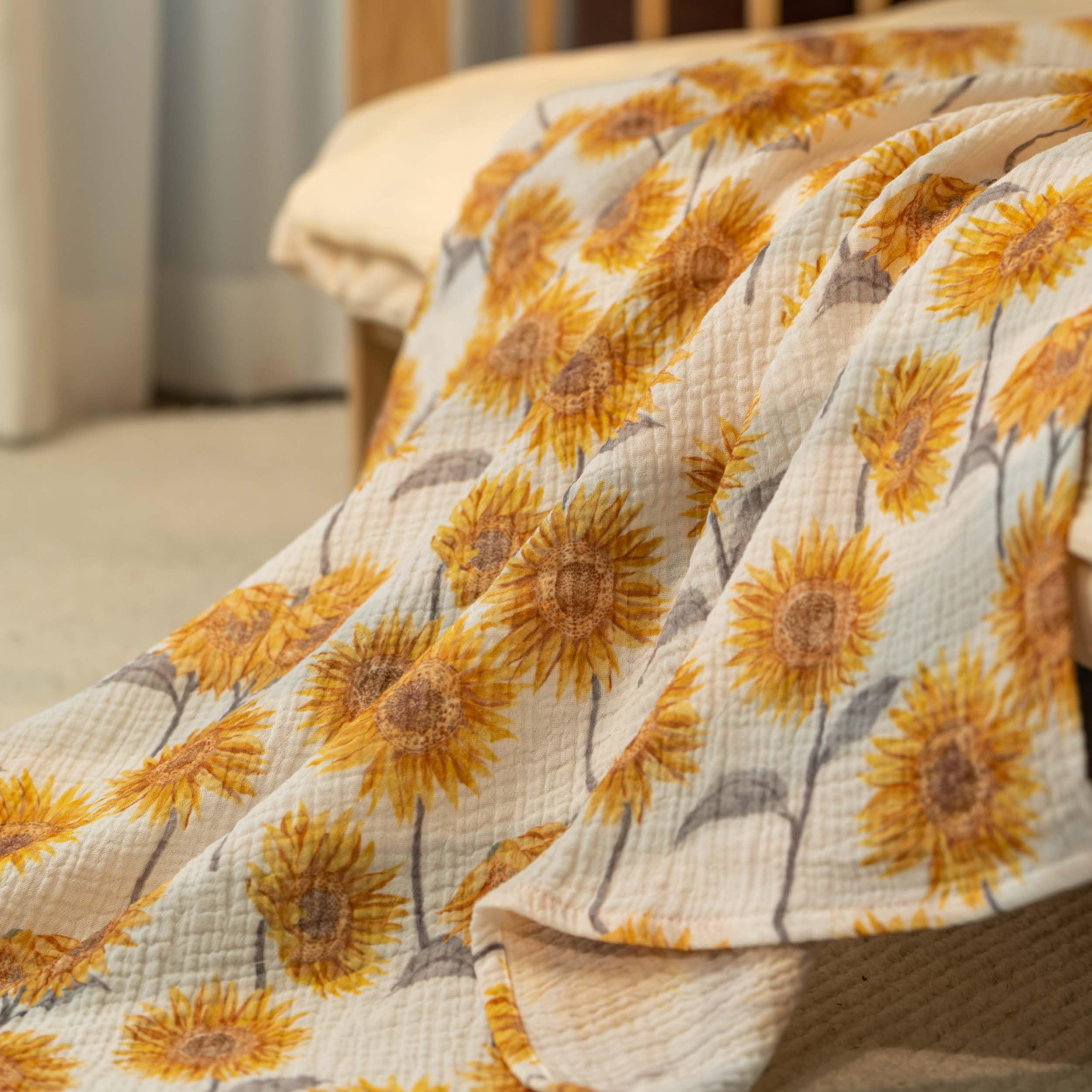 Close-up fabric texture highlights soft, breathable muslin suitable for sensitive newborn skin.
