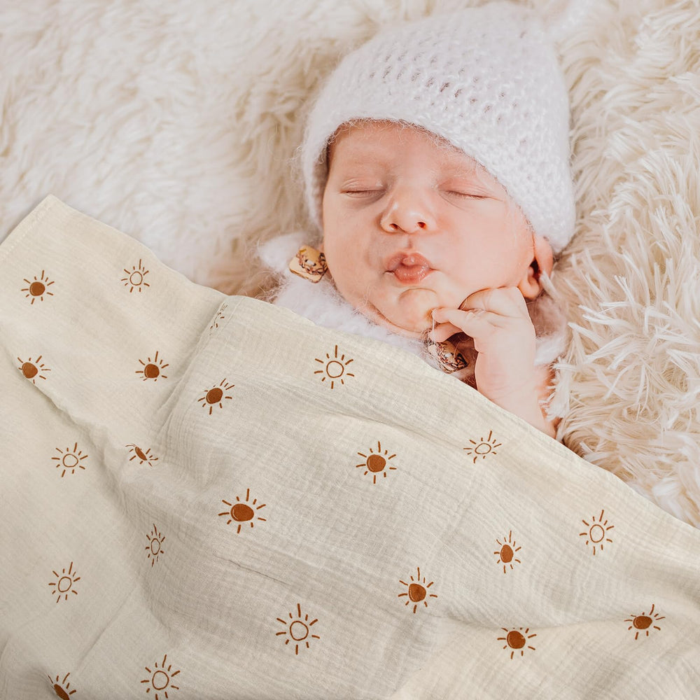 LYRICHOM BABY swaddle blanket supports tummy time with airy weave.