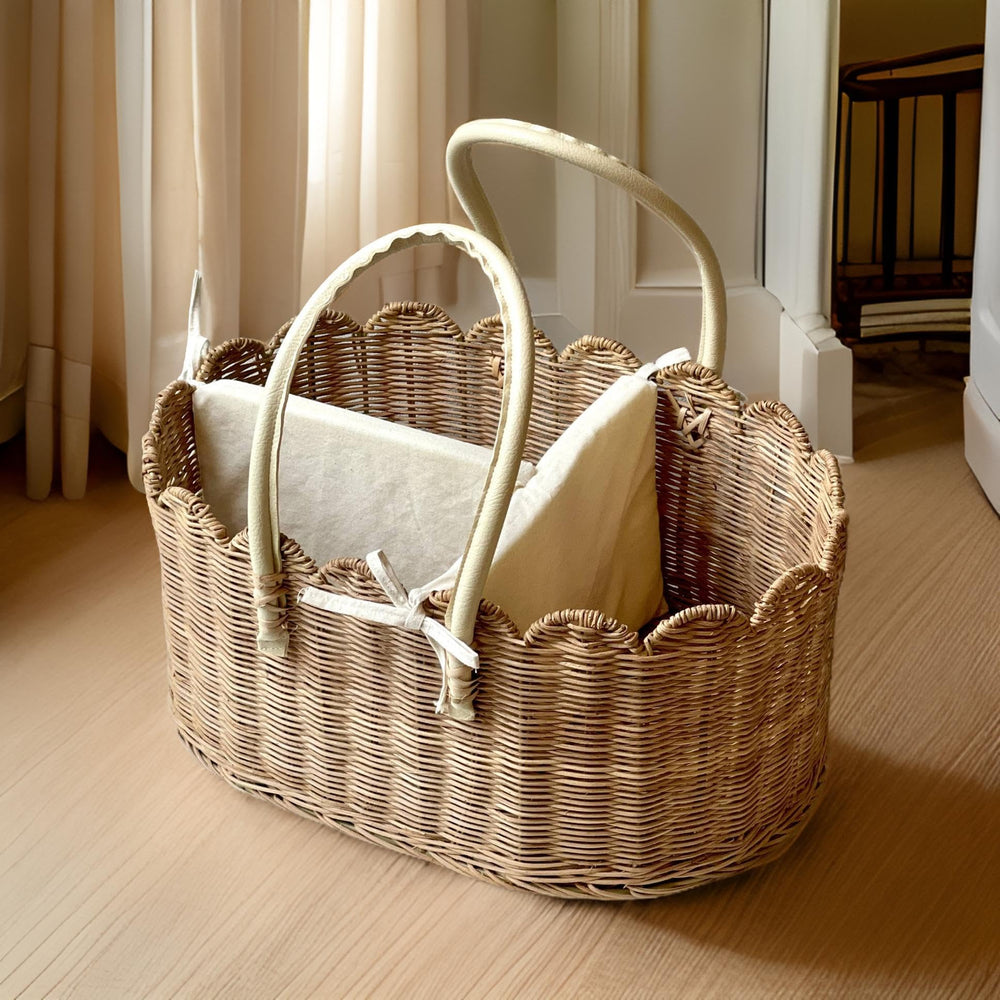 Mae Bird rattan diaper caddy holding diapers and wipes for everyday use.
