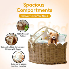 Mae Bird rattan diaper caddy with handles on a changing station for quick access.