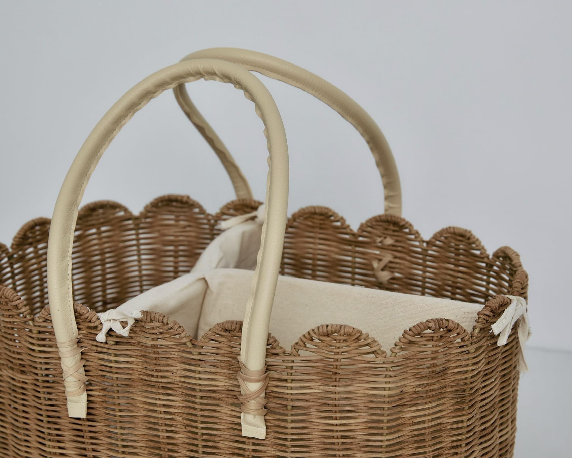 Mae Bird rattan diaper caddy stored post diaper days for decor or storage.