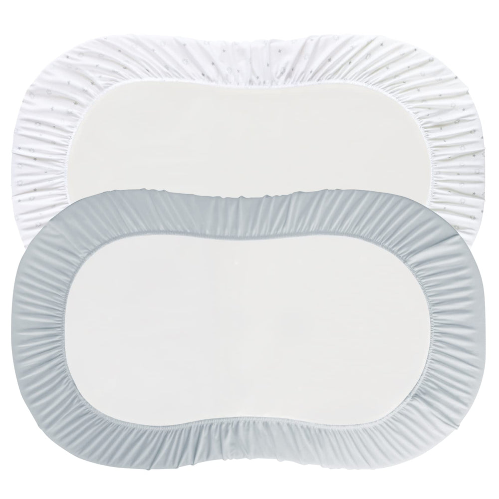 Elastic band closeup showing snug fit on bassinet mattress by Magik & Kover