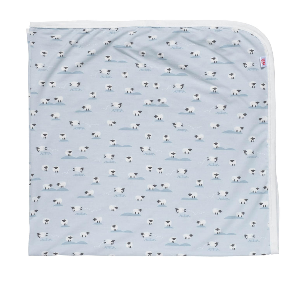 Magnetic Me modal soothing swaddle blanket in Baa Baa Baby Blue for silky softness and cozy snuggles