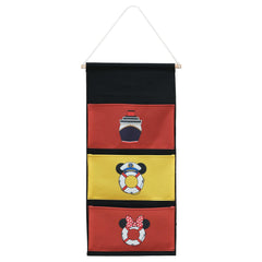 Magopera DCL three-pocket fish extender on cabin door for organized gift exchanges.