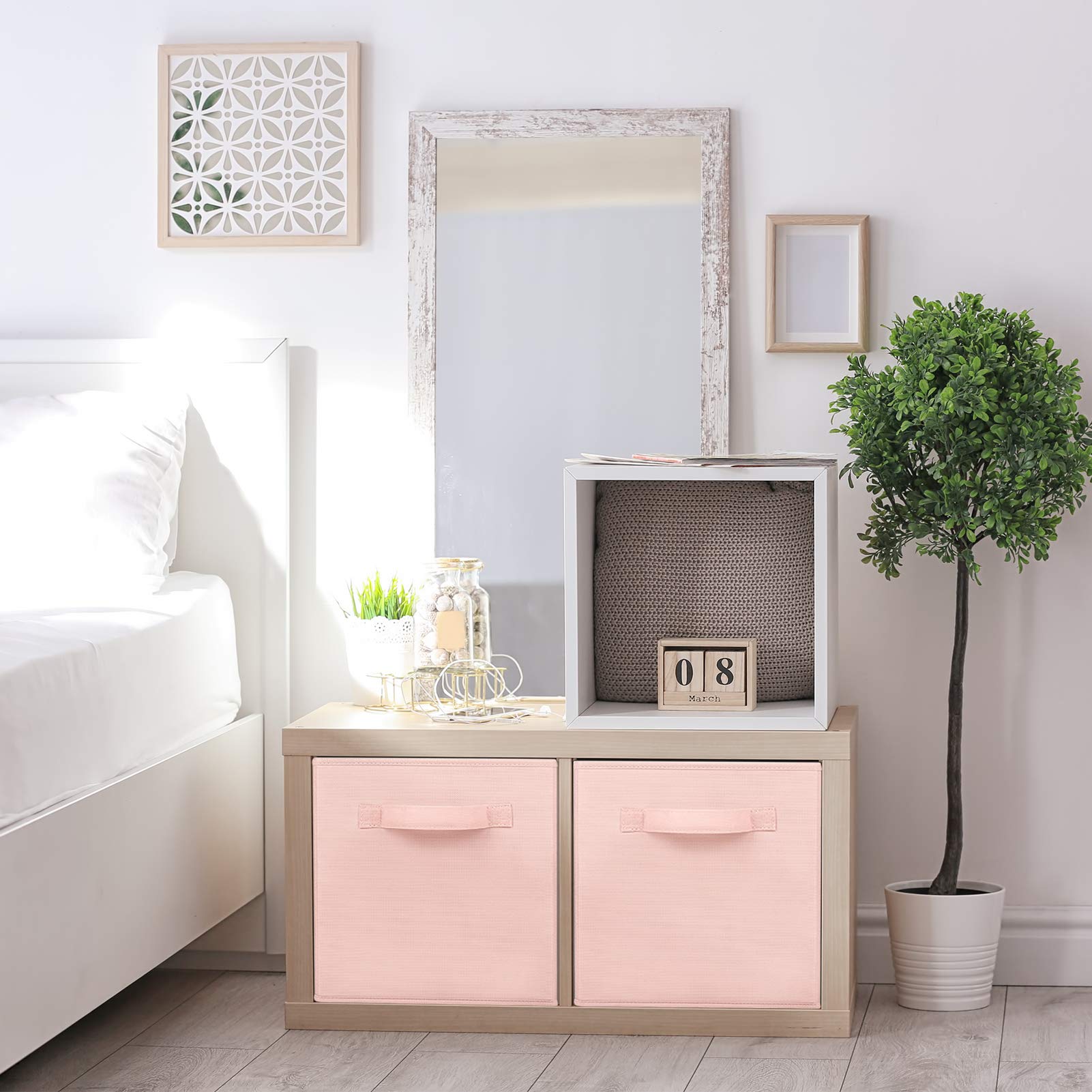MaidMAX pink fabric storage bin, side view, fits neatly on shelves.