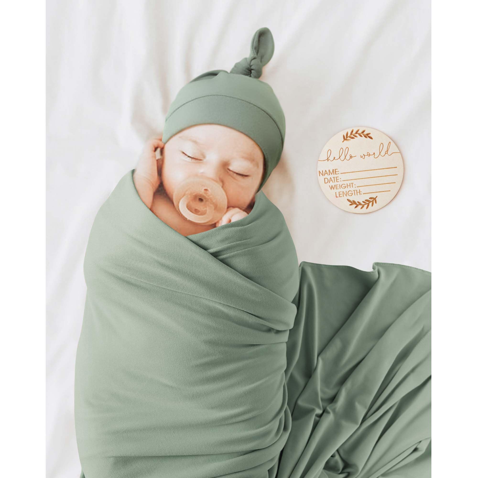MairMore green beanie matching the swaddle set for coordinated looks