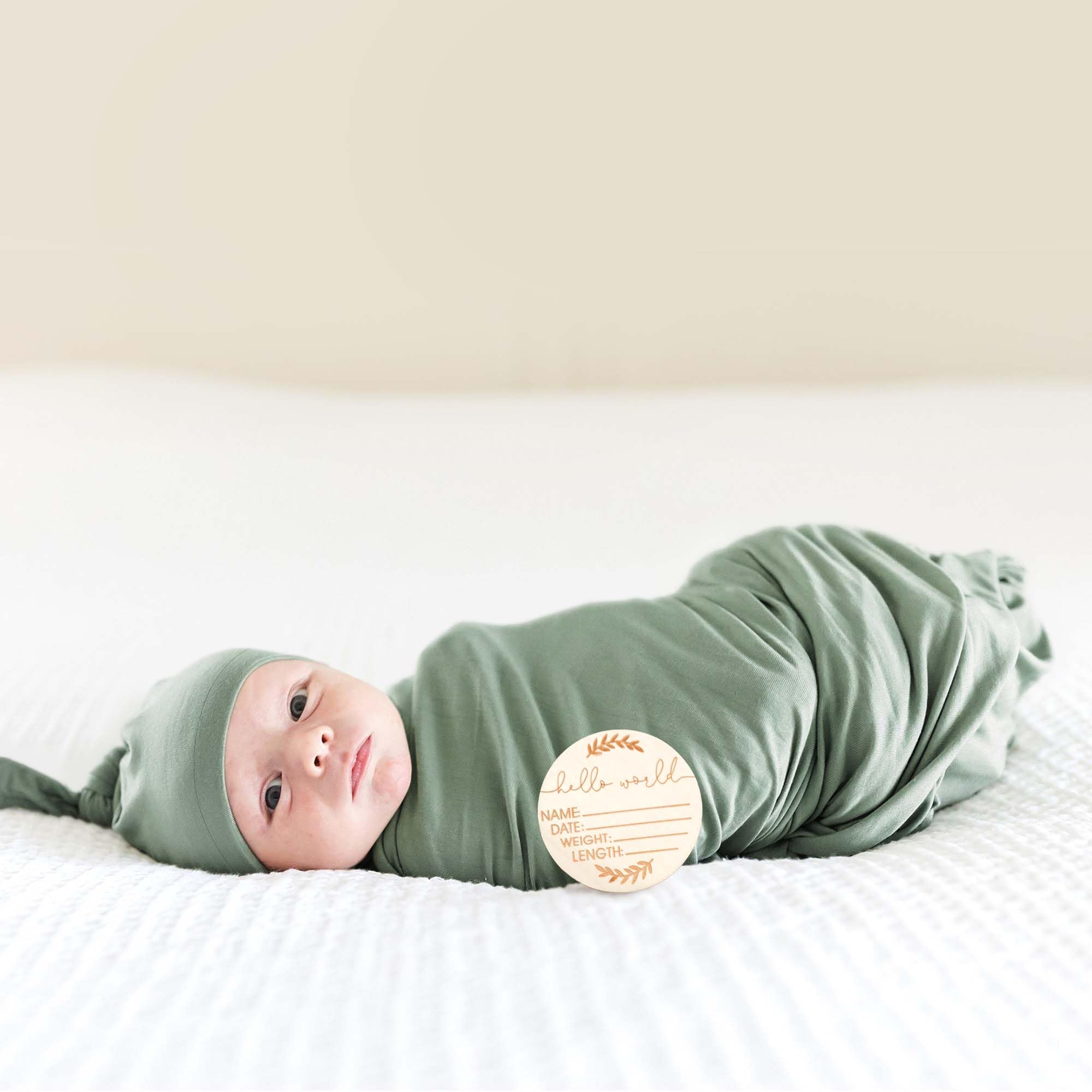 Close-up of MairMore swaddle green fabric detail showing plush texture