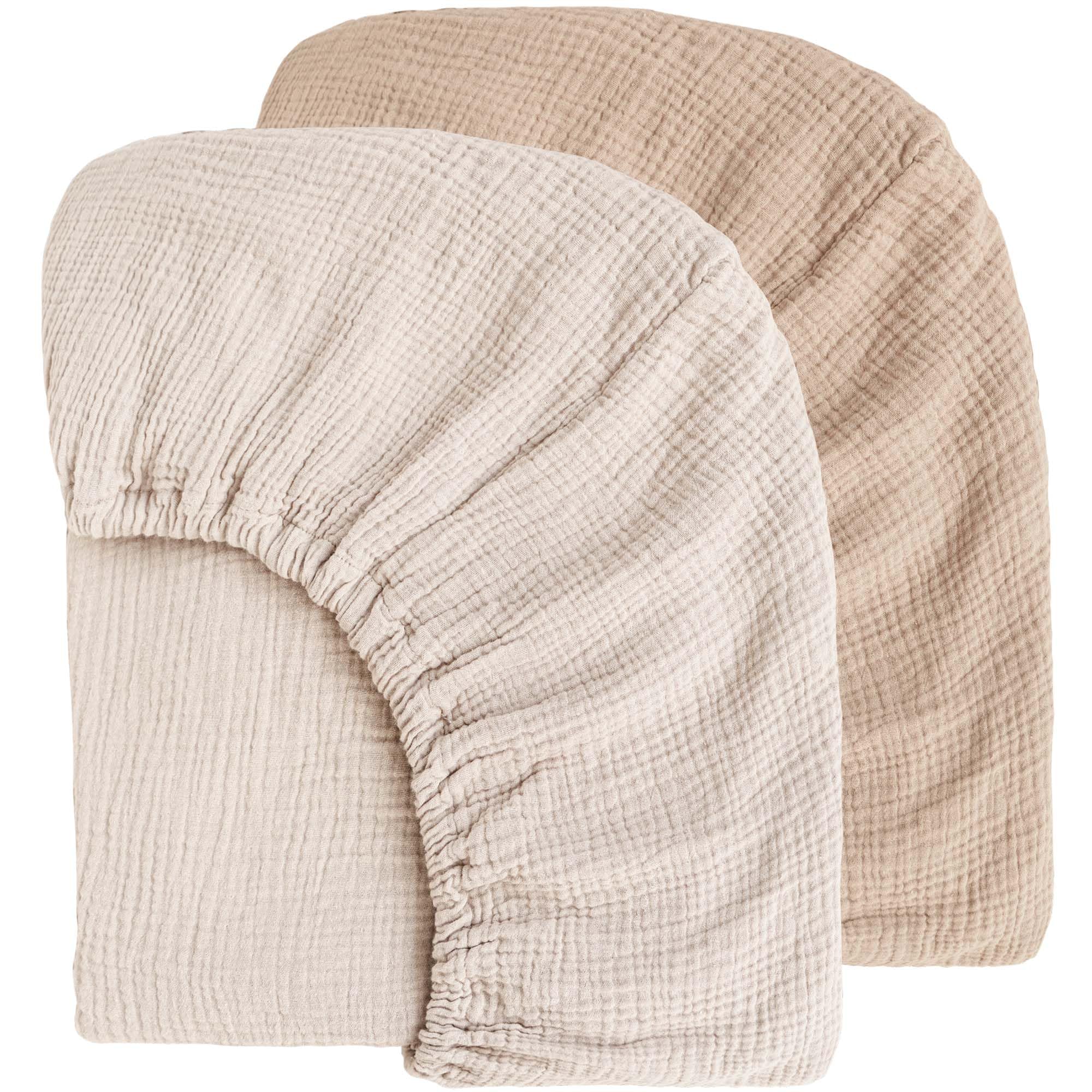 MairMore muslin crib sheet ash close-up shows breathable fabric texture.