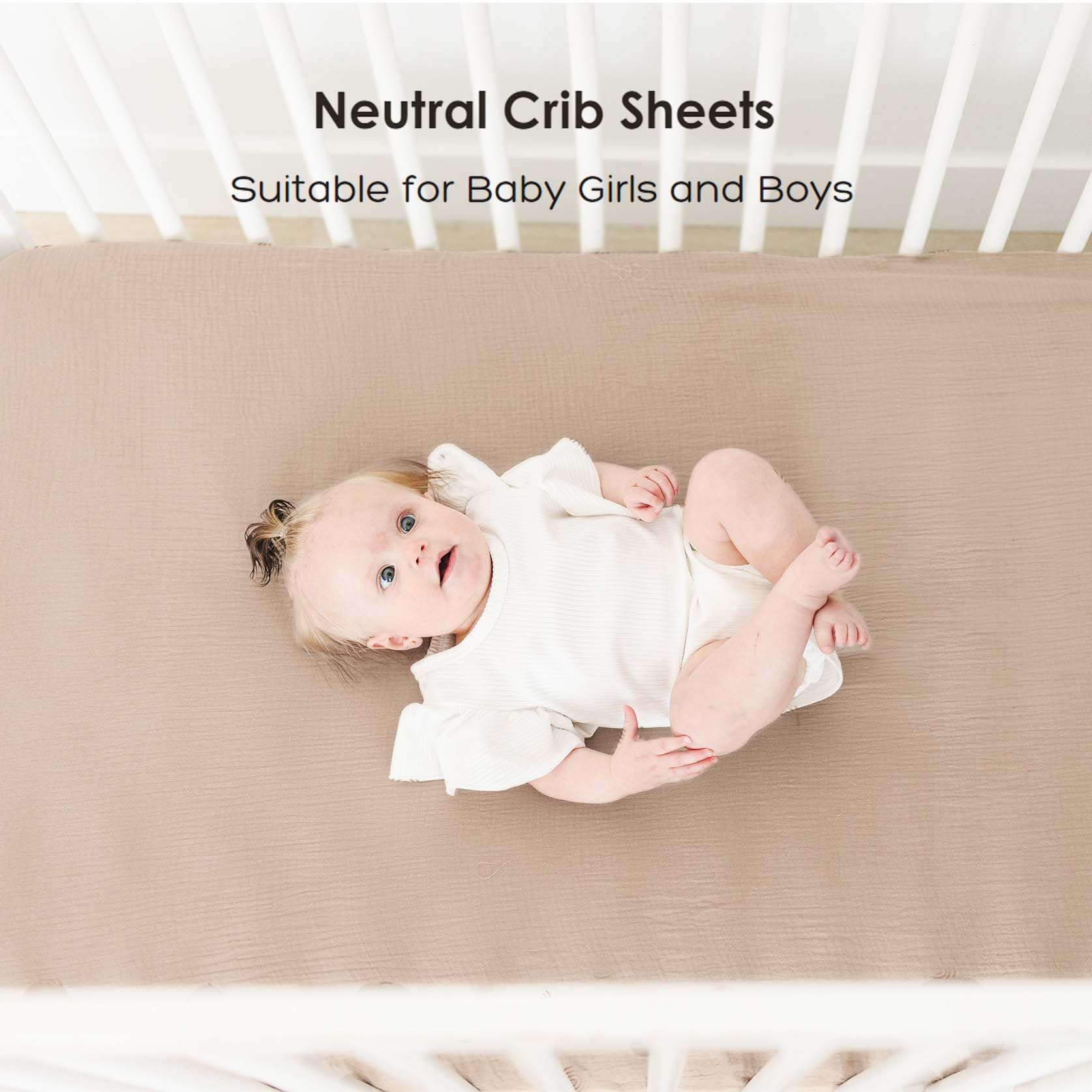 MairMore muslin crib sheet ash shown with baby sleeping on crib.
