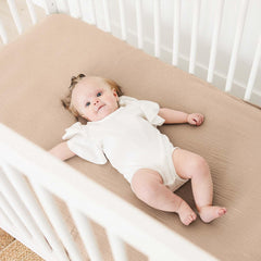 MairMore muslin crib sheet 360° elastic edge shows secure fit.