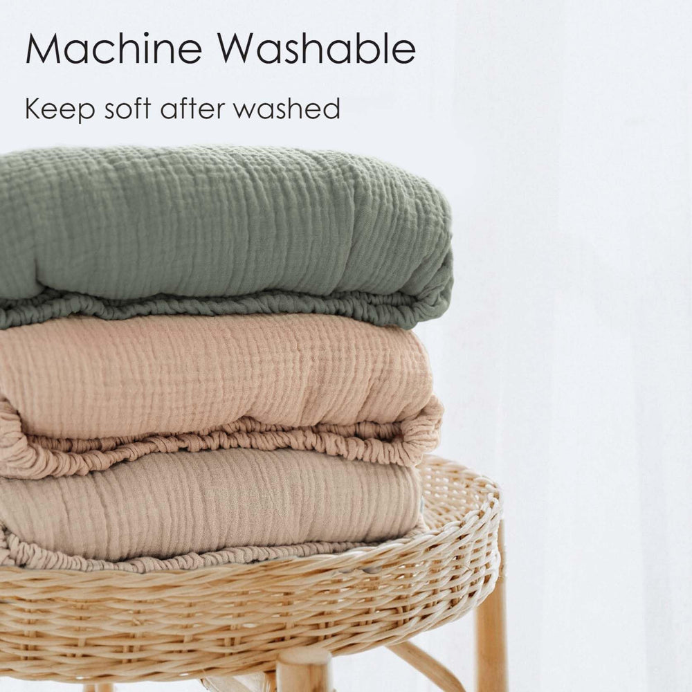 MairMore muslin crib sheet neutral colors complement nursery decor.