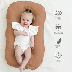 MairMore muslin lounger cover caramel styled in a nursery setup