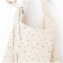 MairMore arch-neckline muslin nursing cover offers breathable privacy during feeding.