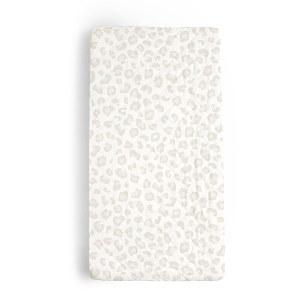 Makemake Organics changing pad cover in wild leopard print for on-the-go diaper changes.