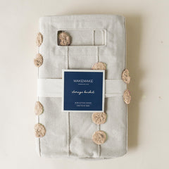 Makemake Organics collapsible fabric bin for easy transport and storage.