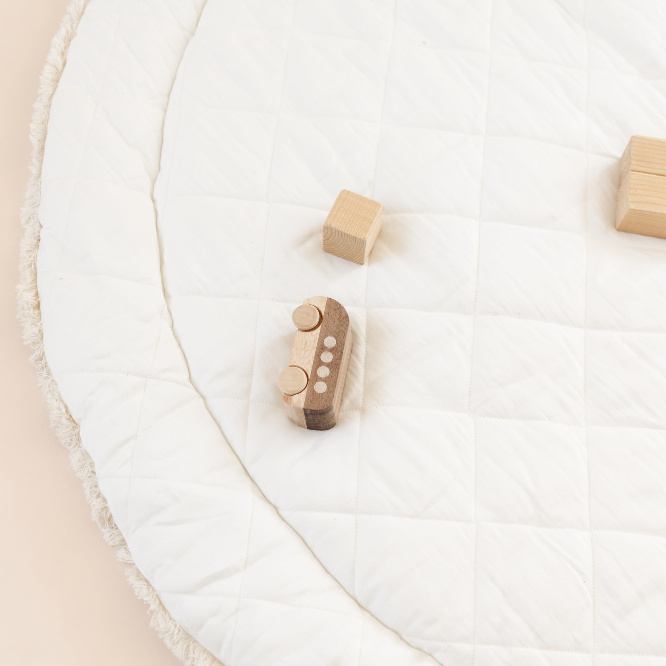 MakeMake Organics GOTS-certified cotton closeup highlights premium material gentle on babies' skin.