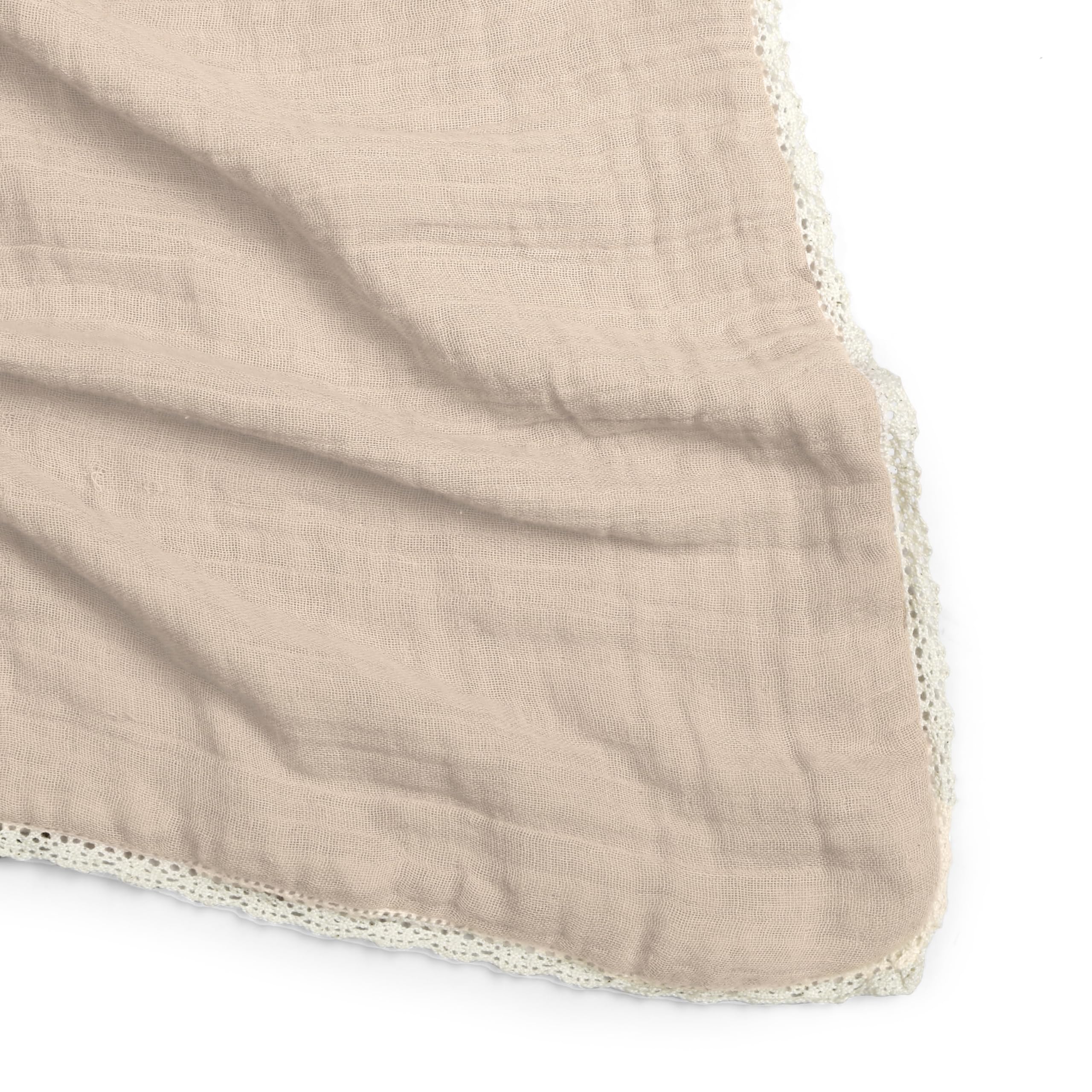 MakeMake Organics muslin blanket used as a car seat cover for shade and breathability.