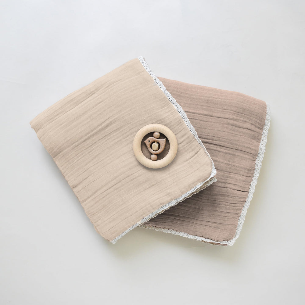 MakeMake Organics GOTS certified blanket logo and fabric detail for safe, organic wear.