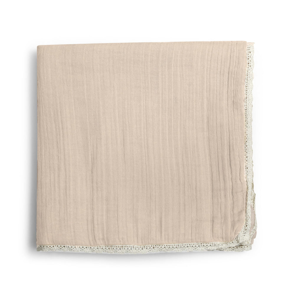 MakeMake Organics muslin blanket close-up texture showing breathable organic cotton for baby comfort.