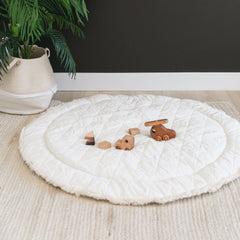 MakeMake Organics play mat round 48 ivory solid offers reversible, stylish nursery surface.