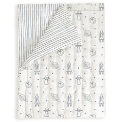 MakeMake Organics toddler comforter with astronaut print gives cozy nights in soft organic cotton