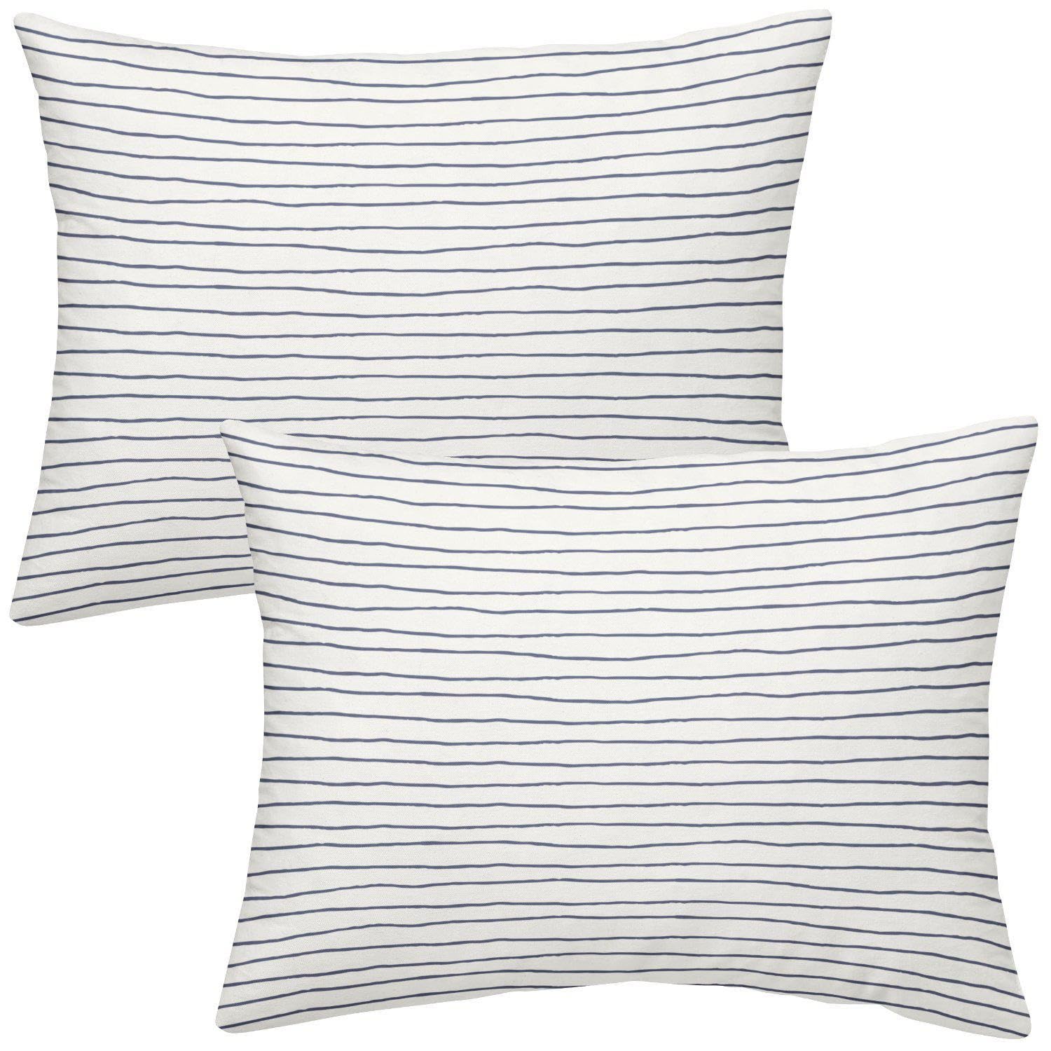 Makemake Organics toddler pillowcase navy stripes closeup with breathable cotton sateen texture.